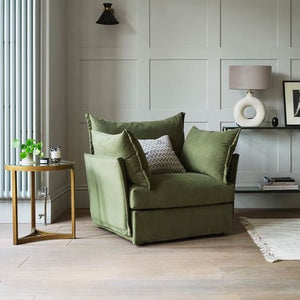 green armchair with round coffee table