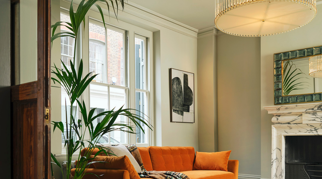 Orange sofa mid century modern room