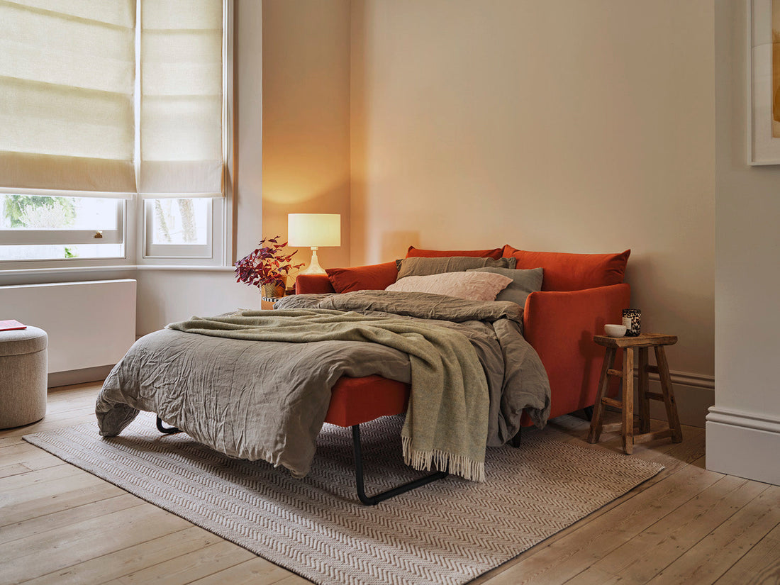 Orange sofa bed set up