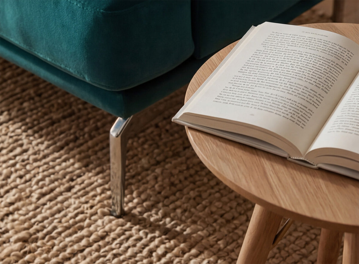 Close-up of the slim stainless steel leg on a Model 14 sofa in Velvet Kingfisher