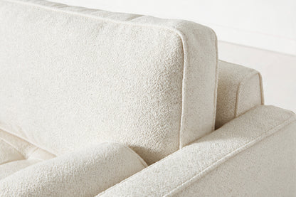 Loveseat in cream bouclé