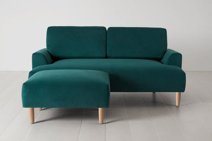 Ottoman in green velvet with oak legs