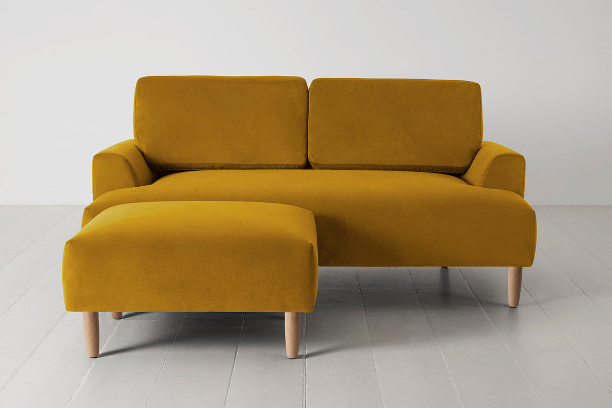 Ottoman in yellow velvet with oak legs